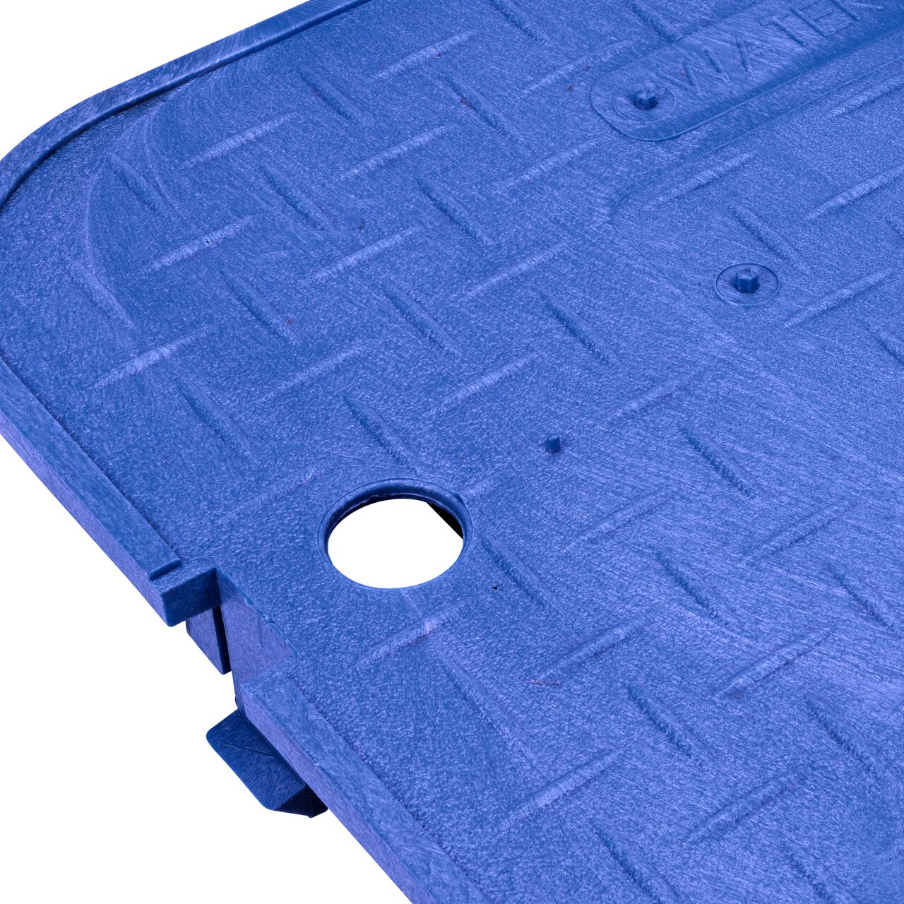 Closeup view of the finger hole on the NDS 14 in. X 19 in. Rectangular Standard Series Blue Water Meter Overlapping cover (NDS D1200-OLBLL) for the NDS 14 in. X 19 in. Rectangular Standard Series Meter Box. place finger inside and lift lid out of the box.