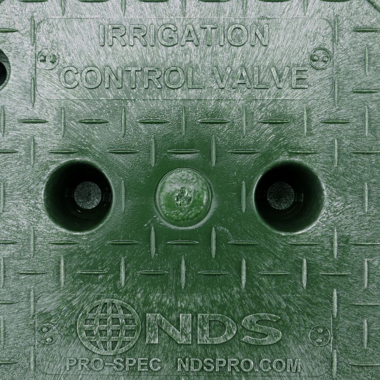 Closeup view of the Irrigation Control Valve markings on the Green Irrigation Control Valve cover (NDS 312BC) for the NDS 10 in. Round Pro-Spec® Series Valve Box