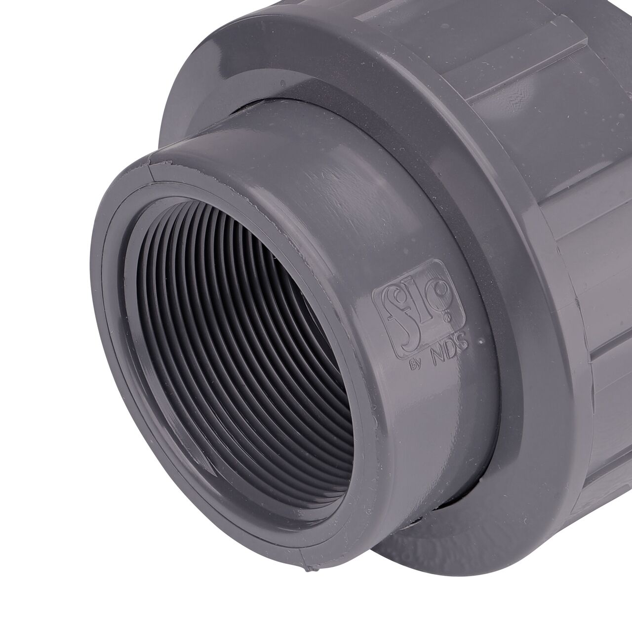 Closeup view of one threaded end on the NDS 2 in. PVC Union (NDS U-2000-T) which provides a corrosion-free connection between pipes and prevents costly property damage