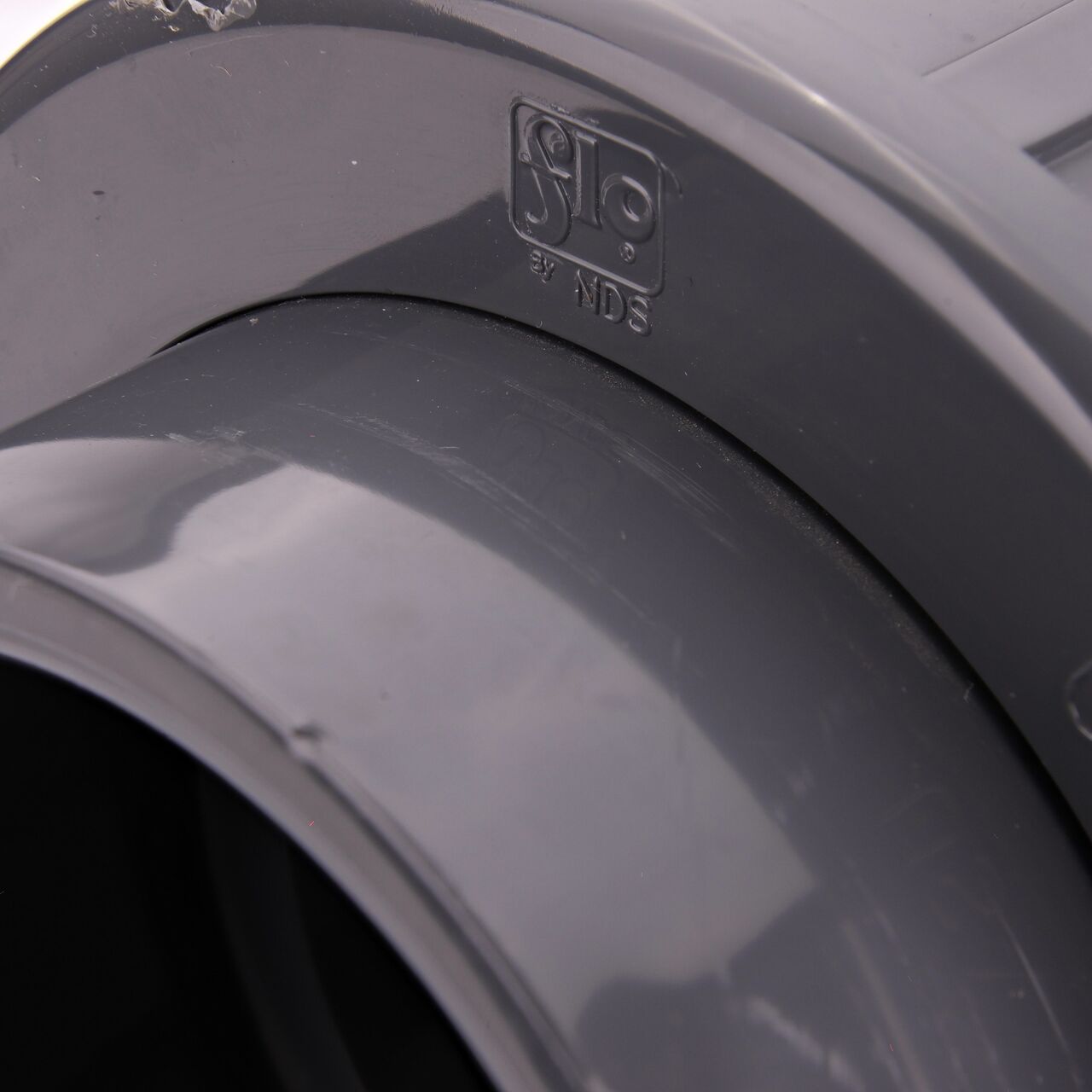 Closeup view of the NDS PVC Union shows each end is labeled that it connects to 3 in. Schedule 80 pipe for residential, commercial, and industrial applications (NDS U-3000-S)