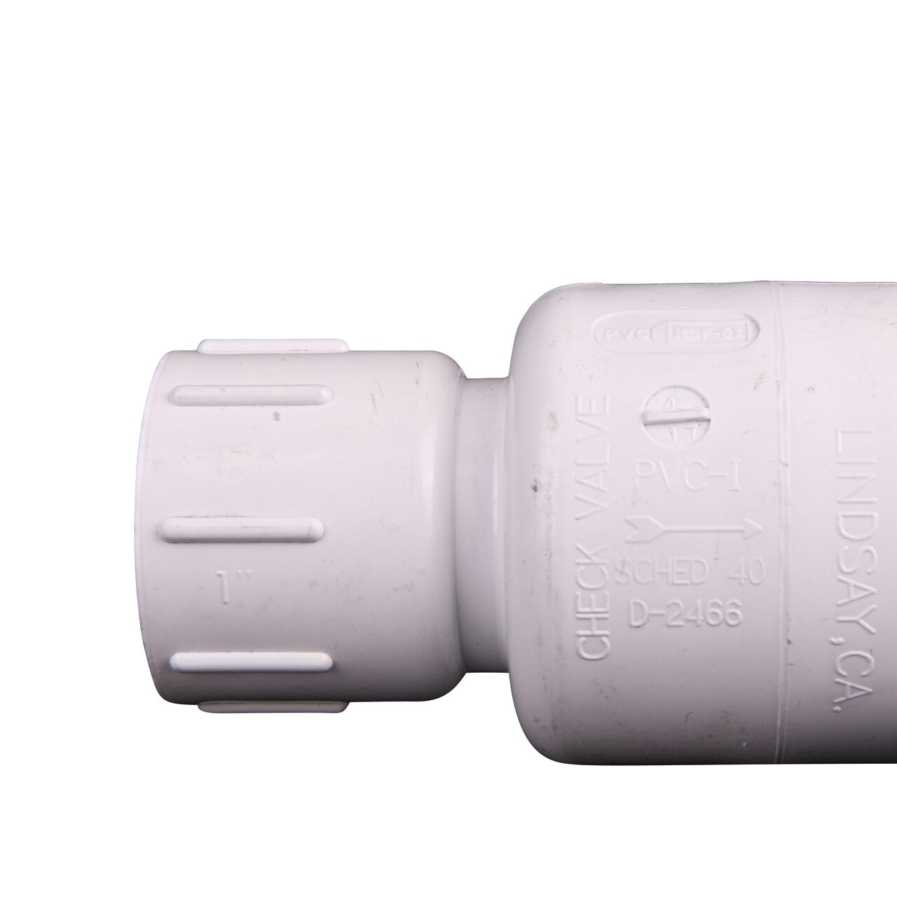 Closeup of the arrow showing water flow on the NDS White 2 in. IPS Slip by Slip end PVC Adjustable Spring Check Valve with 4-1/4-17 lb. Spring (NDS 1225-10)