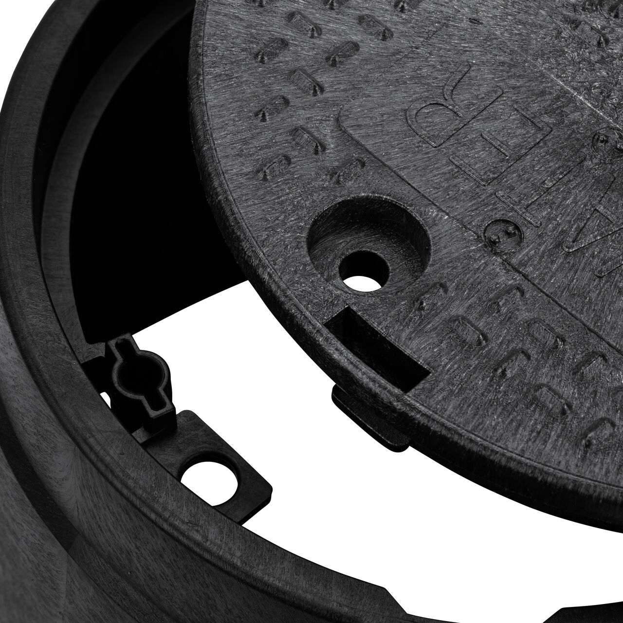 Align the bolt hole on the lid with the bolt hole from the NDS 10 in. Round Standard Series Black Box and Black Water Cover (NDS 111BCW) for a secure fit