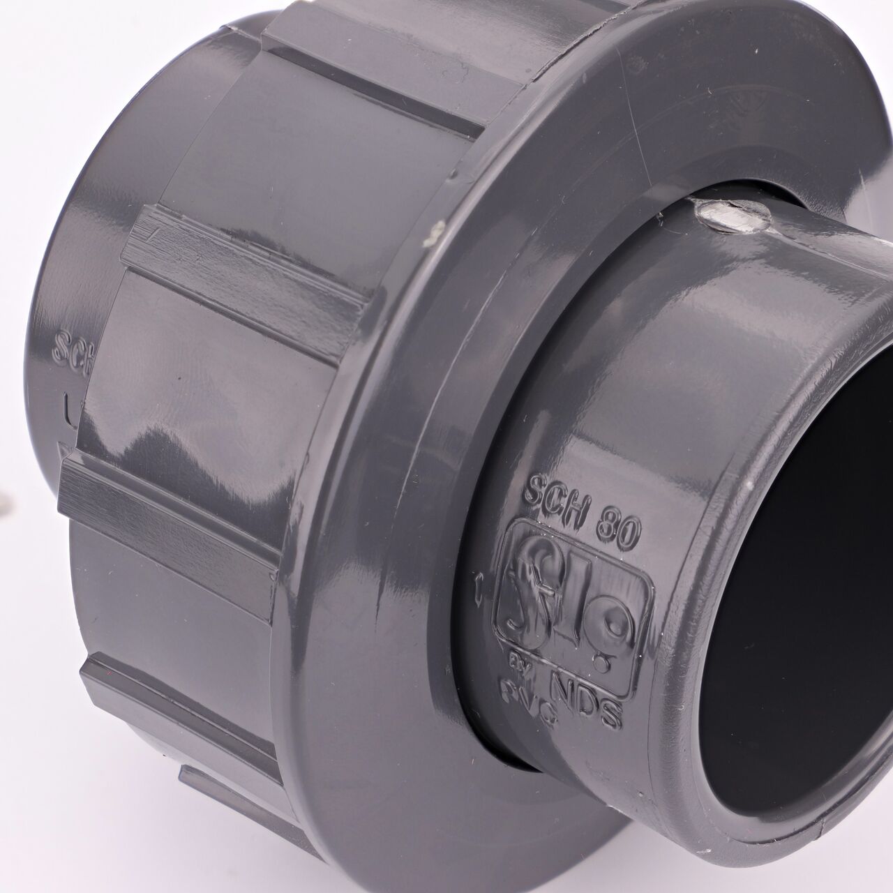 Close up view of the NDS 1-1/2 in. PVC Union showing NDS brand a leader in flow management solutions and the preferred choice of professionals since 1972 mark (NDS U-1500-S)