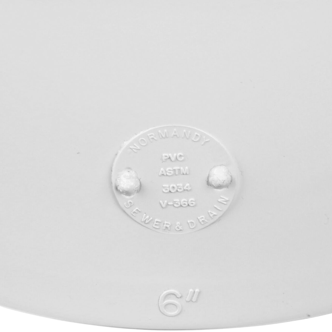 Closeup of the wording on the PVC 90° long-turn elbow, which connects 6 in. Sewer and Drain pipes, Hub X Hub connection (NDS 61P0)