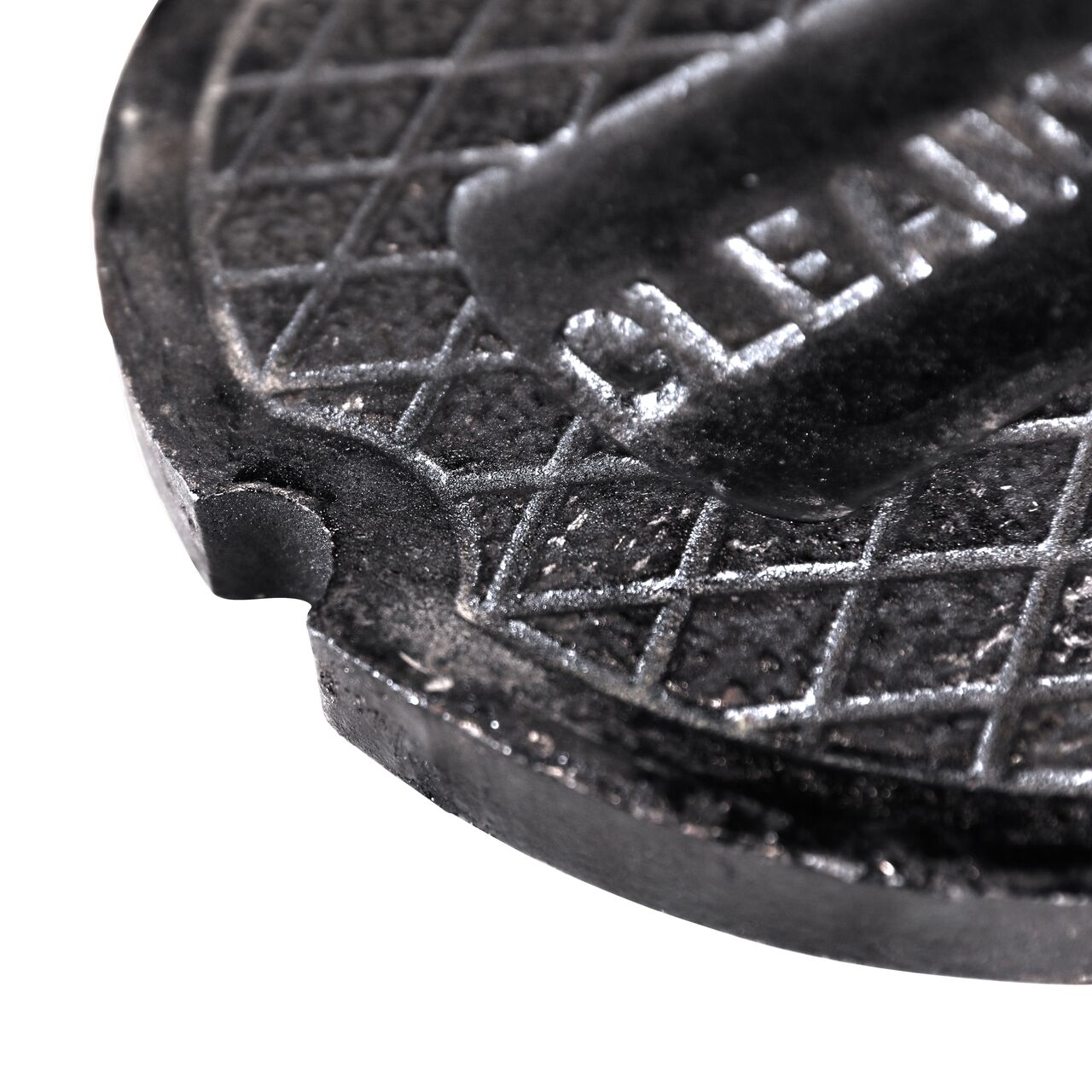 Closeup of the hole indentation on the lid of the NDS 10 in. Frame and Lid (NDS SC-Fl-10) used for Stormchambers