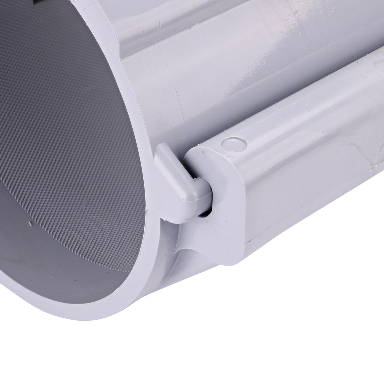 Closeup of the hinge closed on the NDS Clamp-It™ Rigid PVC Saddle with 1 in. FPT connection on top (NDS 444010) for 4 in. PVC pipe