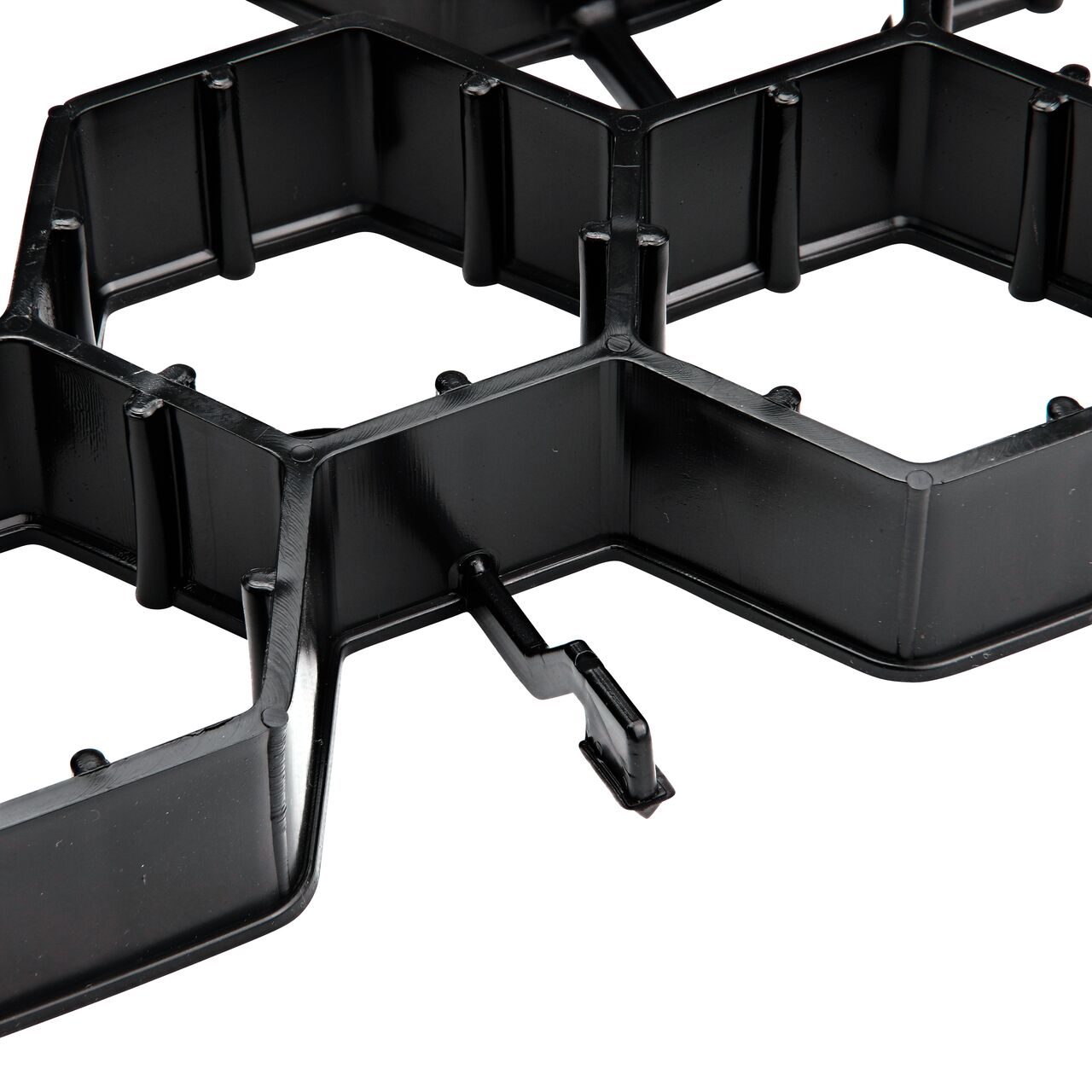 Closeup view of the end to end hook style locking mechanism on the NDS EZ Roll® Grass Pavers