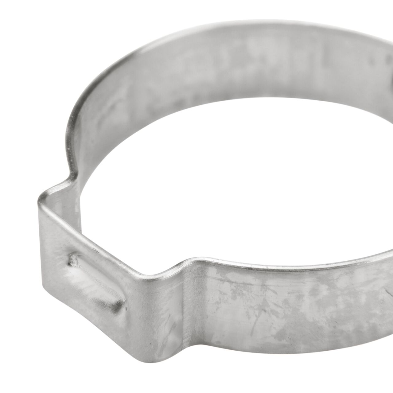 Closeup of the pinch clamp ear end on the NDS 271R Stainless Steel Pinch Clamp (NDS NC155000-016) which bends to confirm a secure, permanent closure.