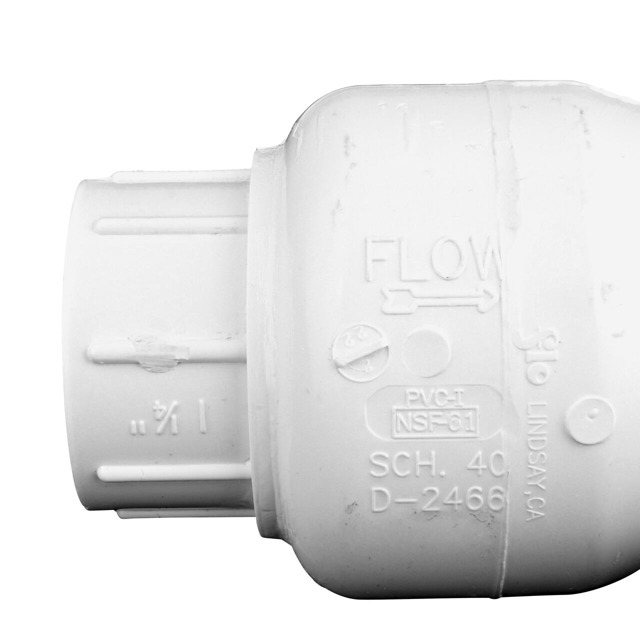 Closeup of the arrow showing water flow direction on the NDS White 1-1/4 in. female end by female end PVC Swing Check Valve (NDS 1520-12F)