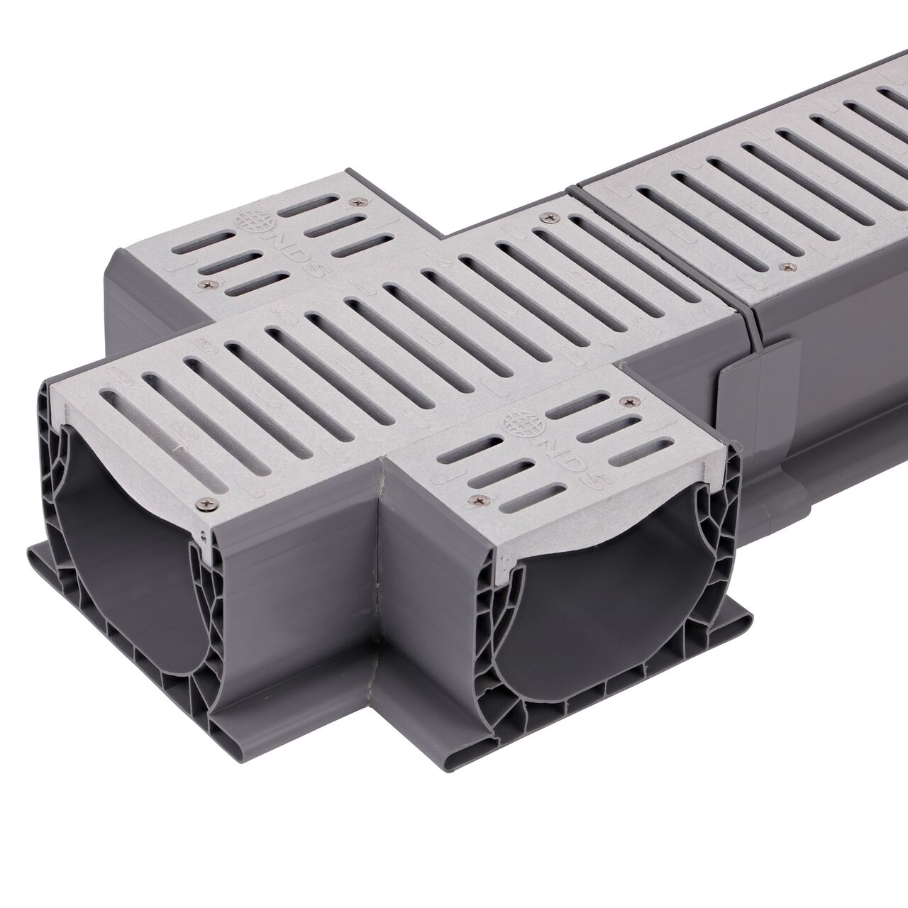 Connect the length on the Spee-D® Channel Drain and Grate with Cross (NDS 2361) to the longer Spee-D® Channel Drain (NDS 400, NDS 400-10, NDS 400-10WH) with the Spee-D® Channel Drain Coupling (NDS 248)