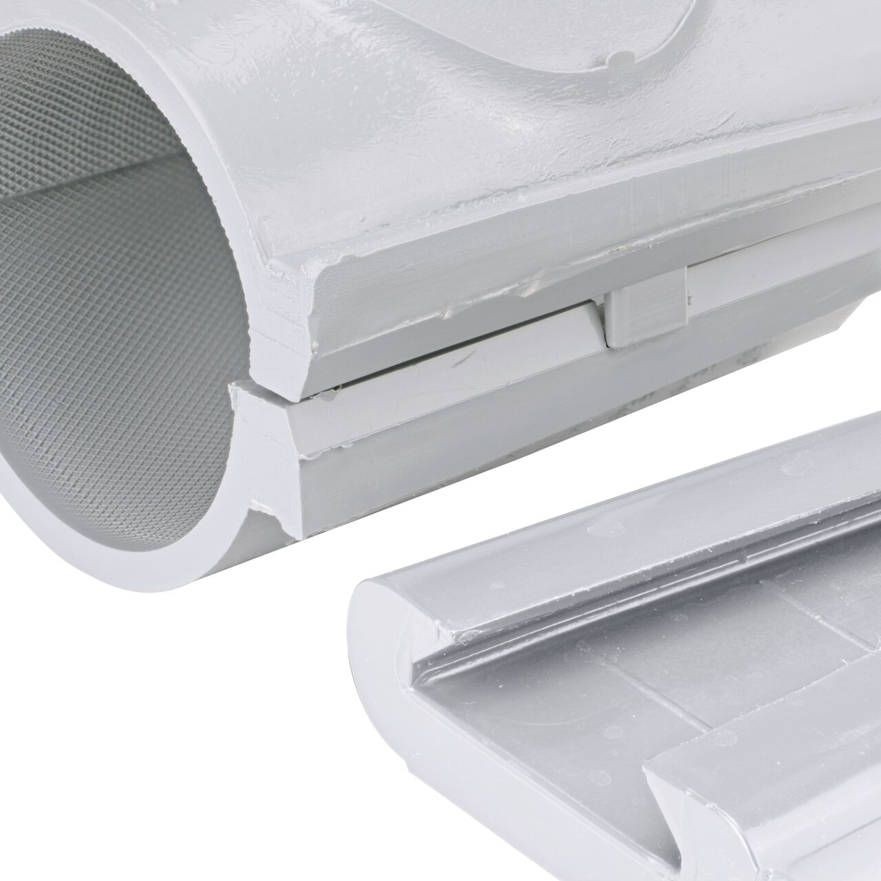 Closeup of the wedge latch uninstalled on the NDS Clamp-It™ Rigid PVC Saddle with 3/4 in. FPT connection on top (NDS 422007) for 2 in. PVC pipe