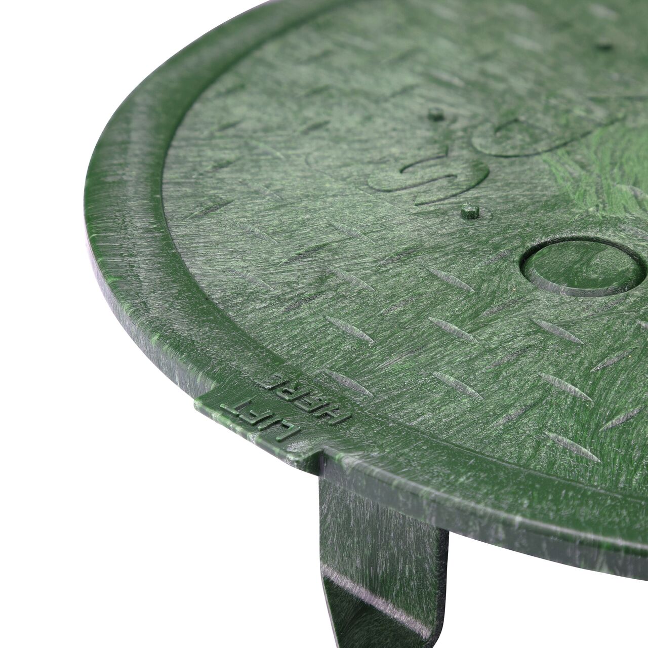 Closeup of the 10 in. Round SureFit Universal Valve Box Lid Lift Tab to lift cover for removal (NDS 10RND-UC)