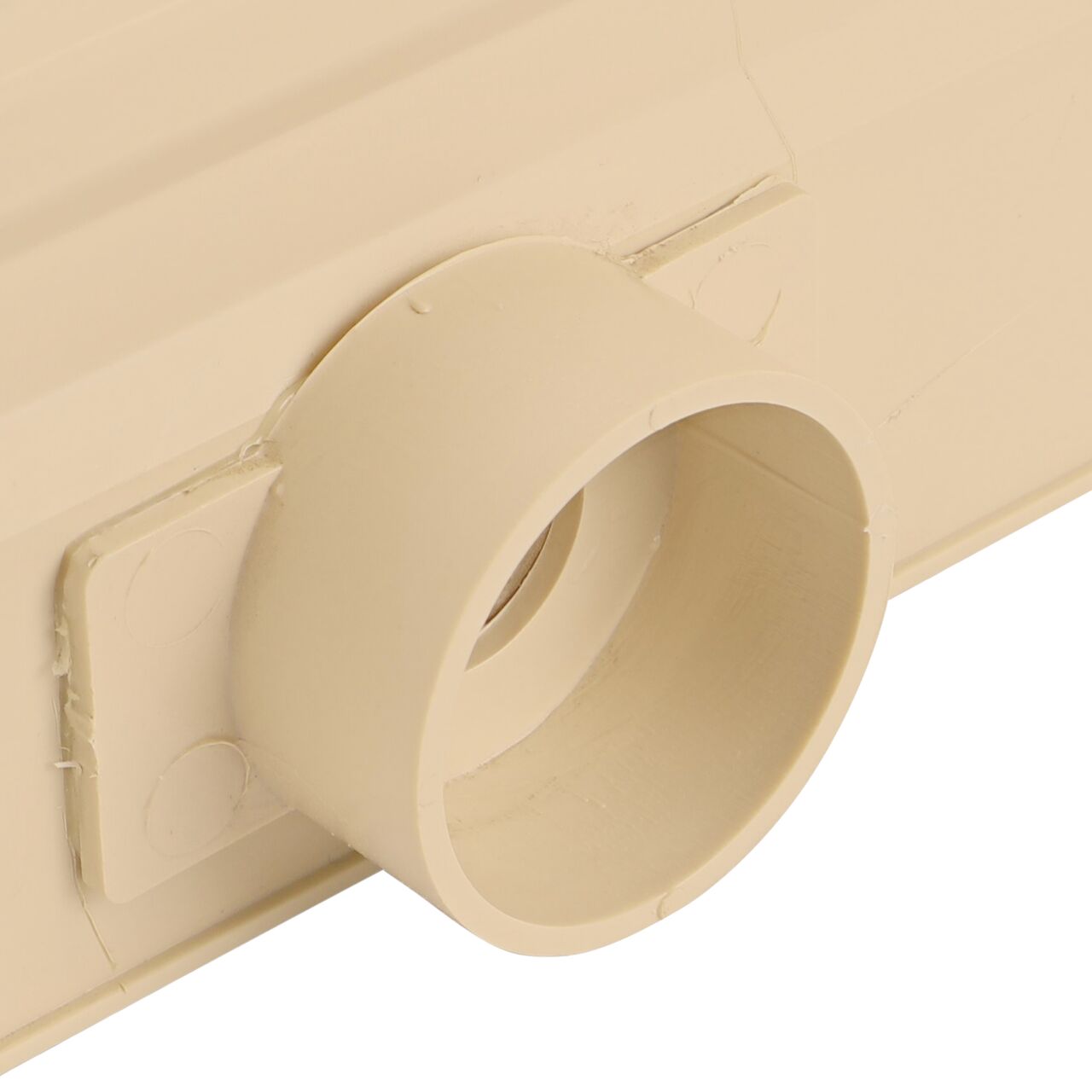 Closeup of the outlet opening of the NDS Micro Channel™ Drain & Integrated Grate Side Outlet (NDS 8512)