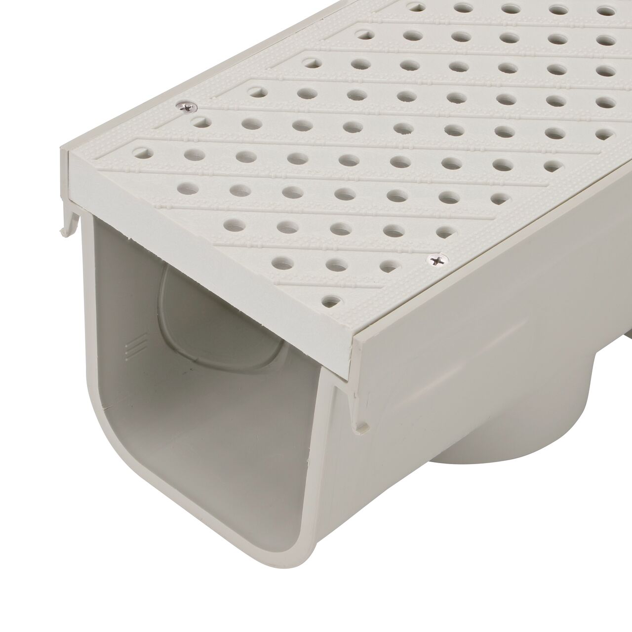 Closeup view of the Light Gray Plastic 5 in. Pro Series Channel Drain Grate (NDS 826) installed on the 5 in. Pro Series Channel Drain (NDS 800)