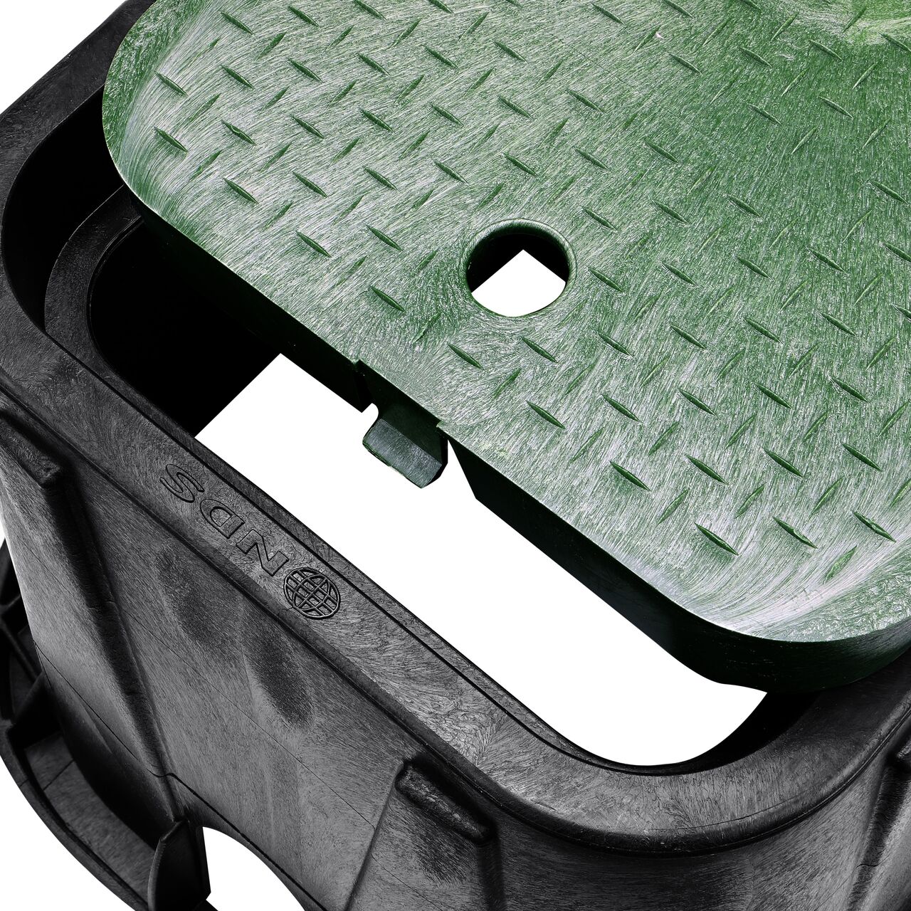 Align the bolt hole on the lid with the universal locking mechanism hole from the NDS 14 in. X 19 in. Rectangular Standard Series Black Meter Box and Green Sewer Cover (NDS D1200-DISGSWR) for a secure fit