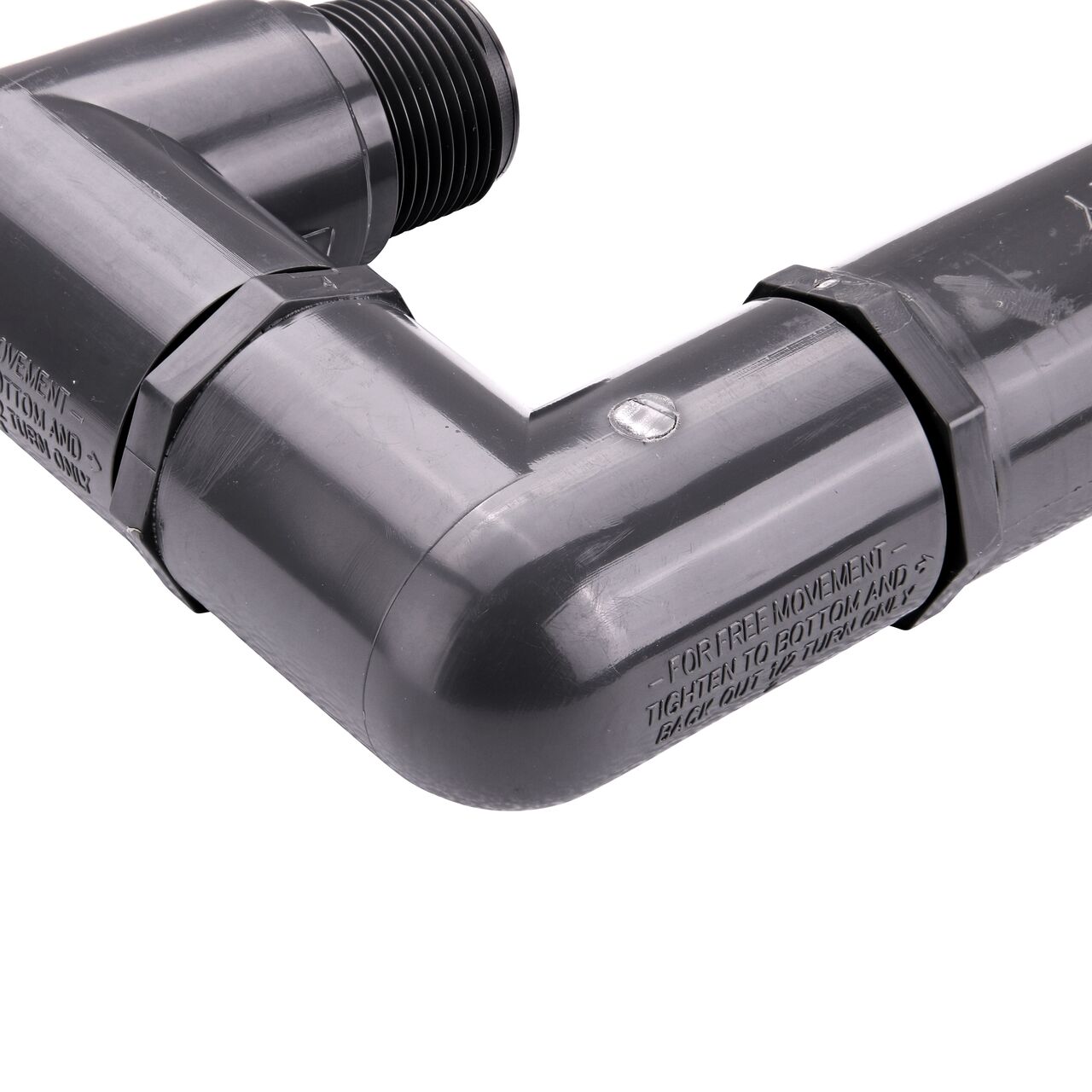 Closeup view of the NDS PVC Triple Swing Joints Assembly, Sch. 80 1 in. MPT showing the flow direction and sprinkler can easily be repositioned after installation if needed (NDS TSA-1000-TT)
