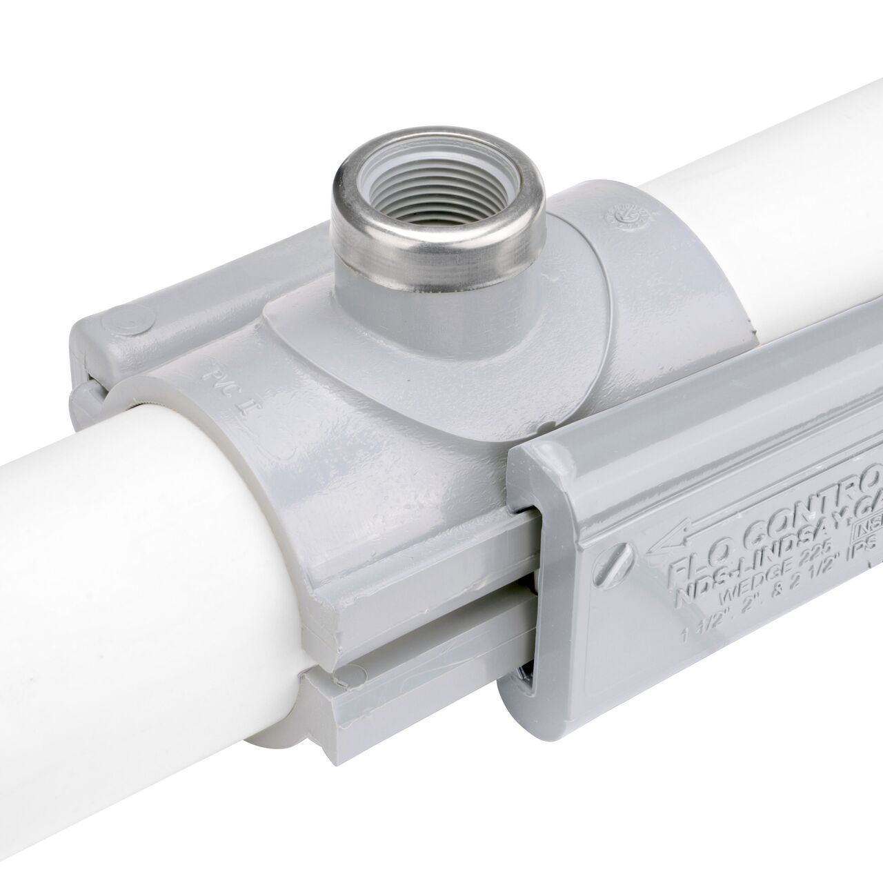 The NDS Clamp-It™ Rigid PVC Saddle with 3/4 in. FPT connection on top (NDS 422007) installed onto 2 inch PVC pipe with the wedge closure half-way secure