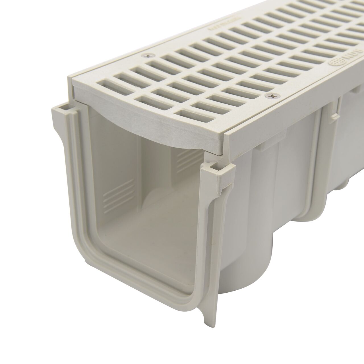 NDS 3 in. Pro Series Channel Drain grate is placed on the grate seat in the channel drain (NDS 714)