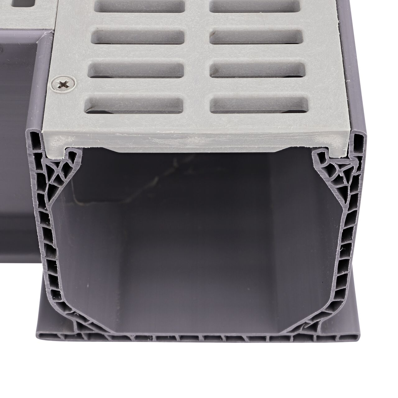 Closeup of the top of the opening showing the grate design of the NDS Gray Mini Channel™ Drain 90° Elbow and Grate (NDS 5380)