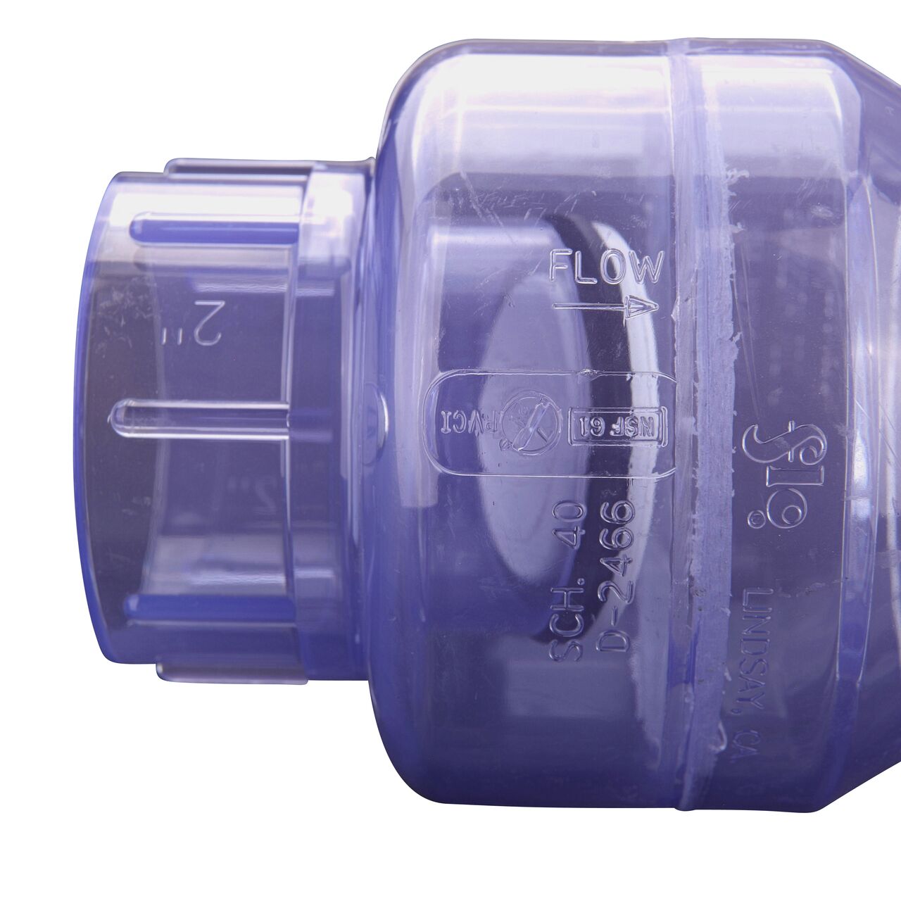 Closeup of the arrow showing water flow direction on the NDS Clear 2 in. slip end by slip end PVC Swing Check Valve (NDS 1520C20)