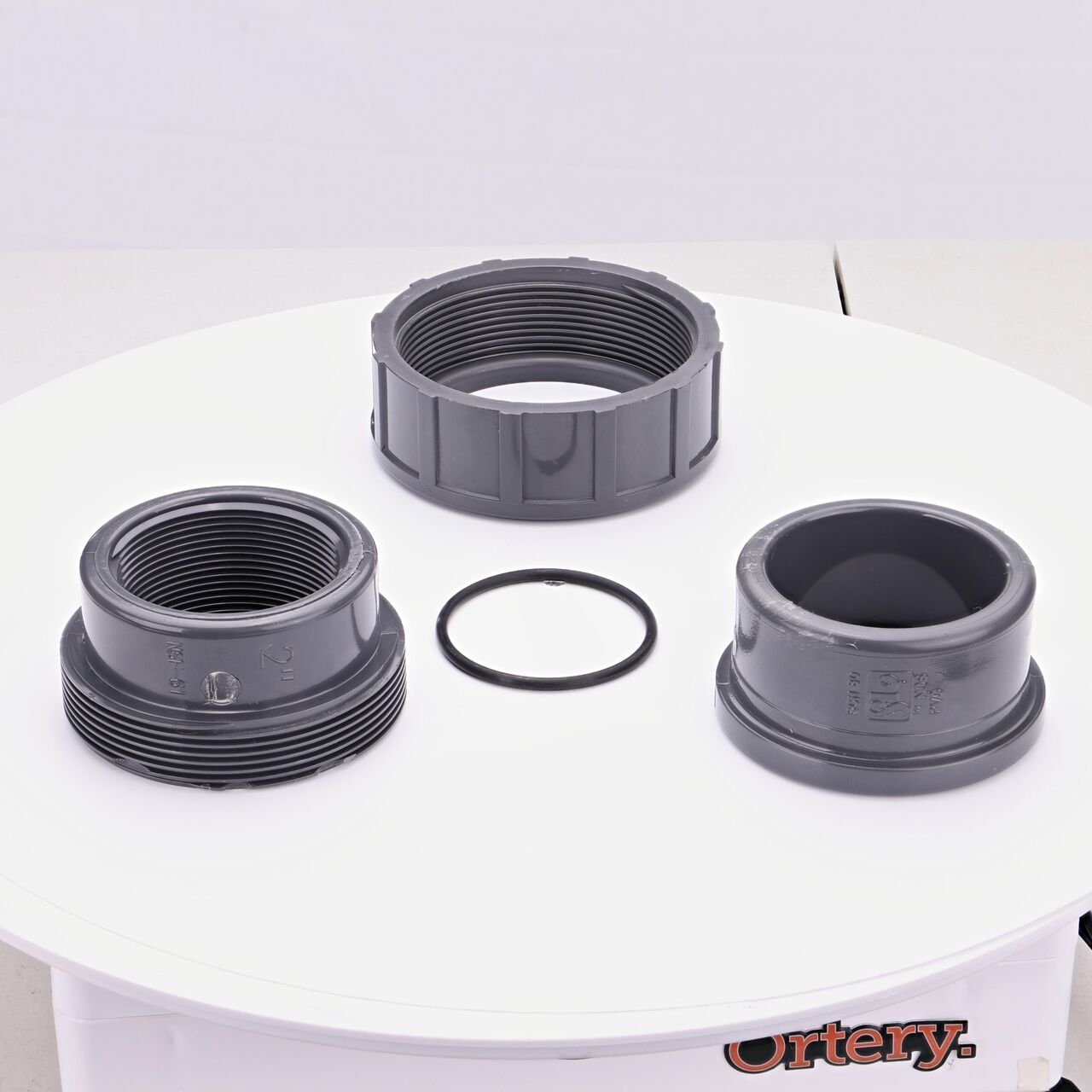 NDS PVC Union, 2 in. Sch. 80 S X FPT shown here unassembled includes the EPDM O-ring that is placed in the center of the union to create a leak-resistant seal (NDS U-2000-ST)