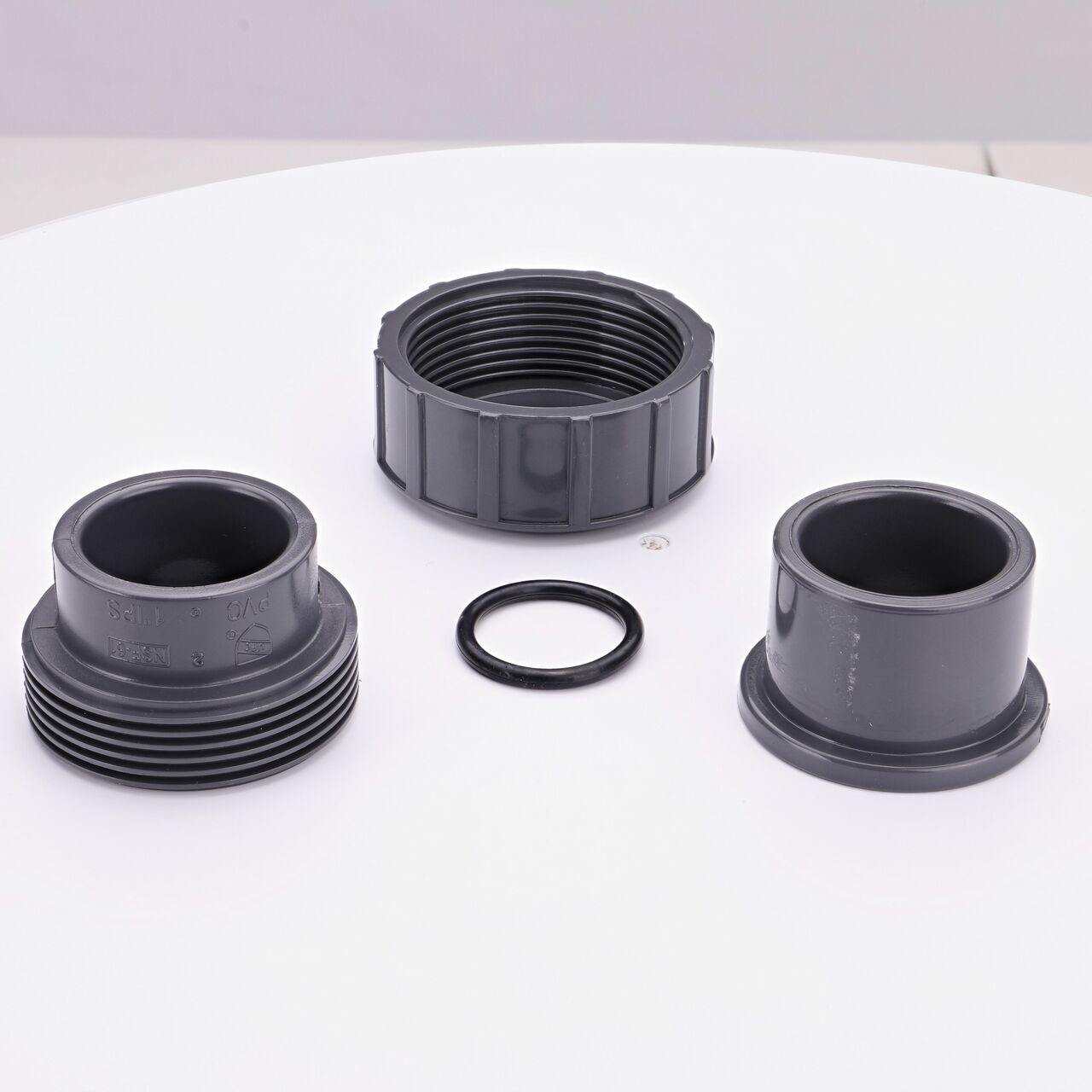 The NDS 1 in. PVC Union shown here unassembled, includes the EPDM O-ring that is placed in the center of the union to create a leak-resistant seal (NDS U-1000-S)