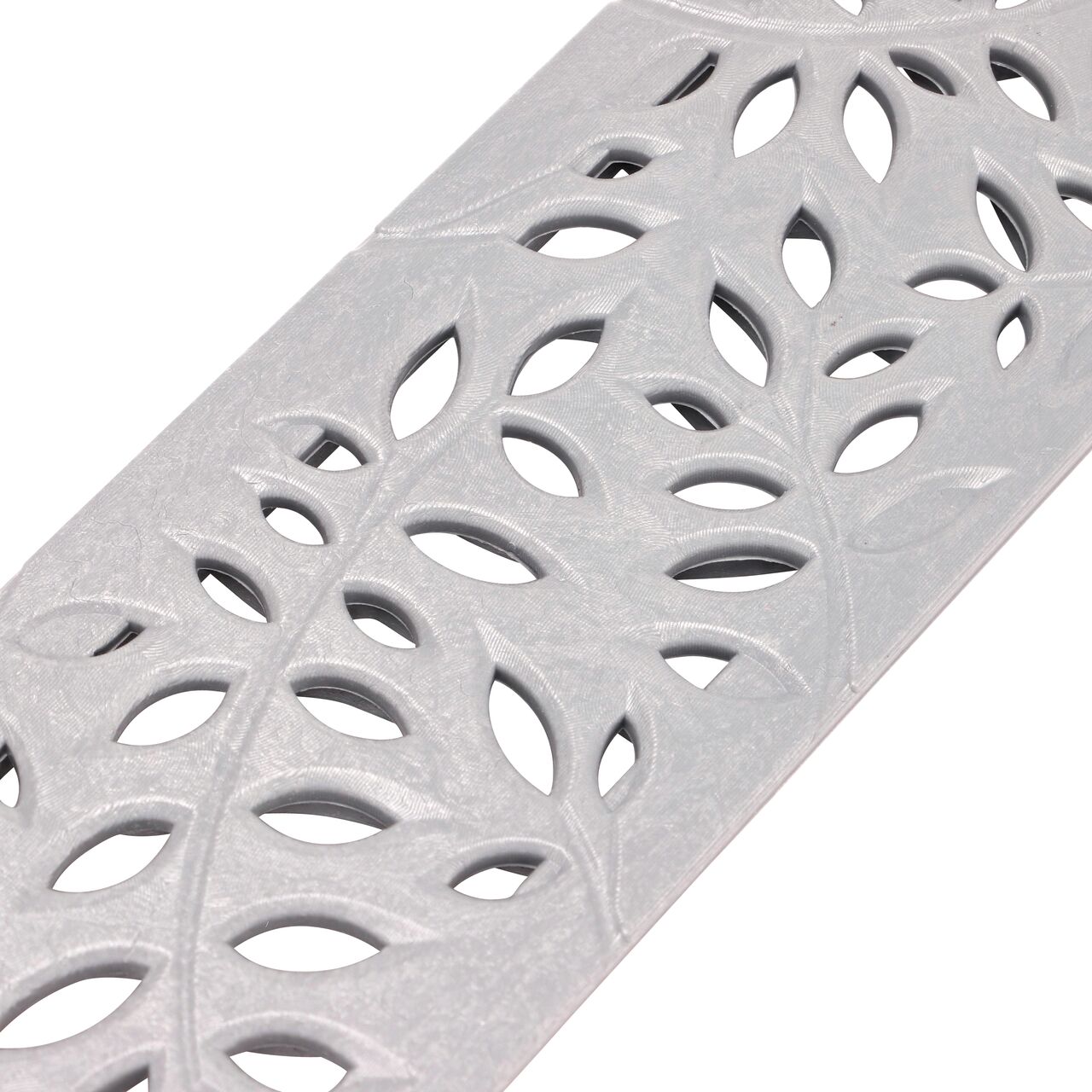 Closeup View of the Decorative Botanical Green Plastic Mini Channel™ Drain Grate Design (NDS 554GY)