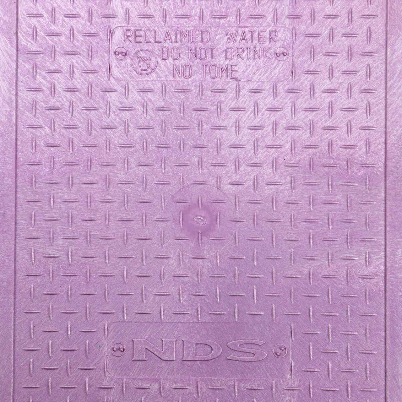 Closeup view of the Reclaimed Water markings on the Purple Reclaimed Water cover (NDS 313CR) for the NDS 14 in. X 19 in. Rectangular Pro-Spec® Series Valve Box