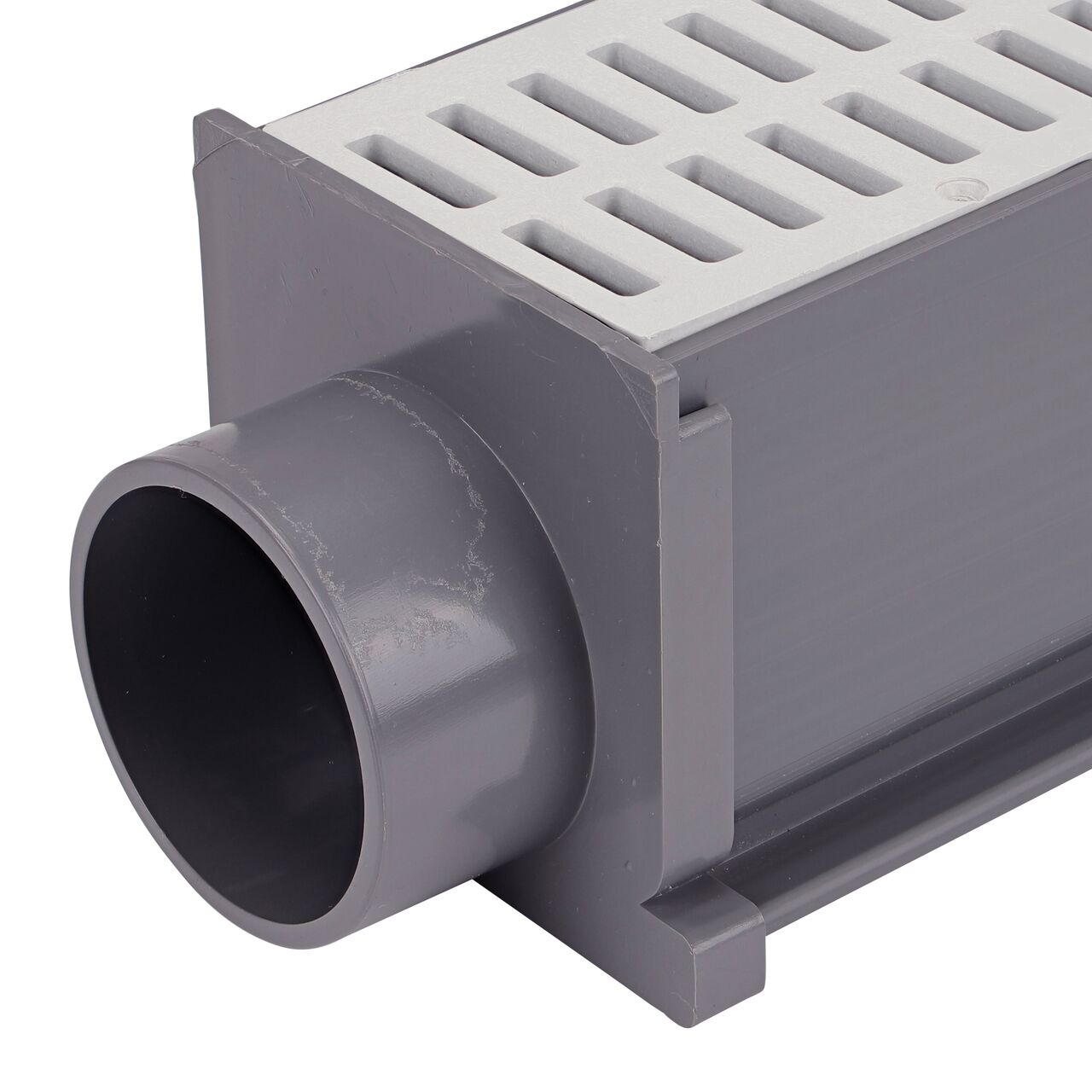 Closeup of The NDS Gray Mini Channel™ Drain End Outlet (NDS 546) attached to mini channel drain with grate