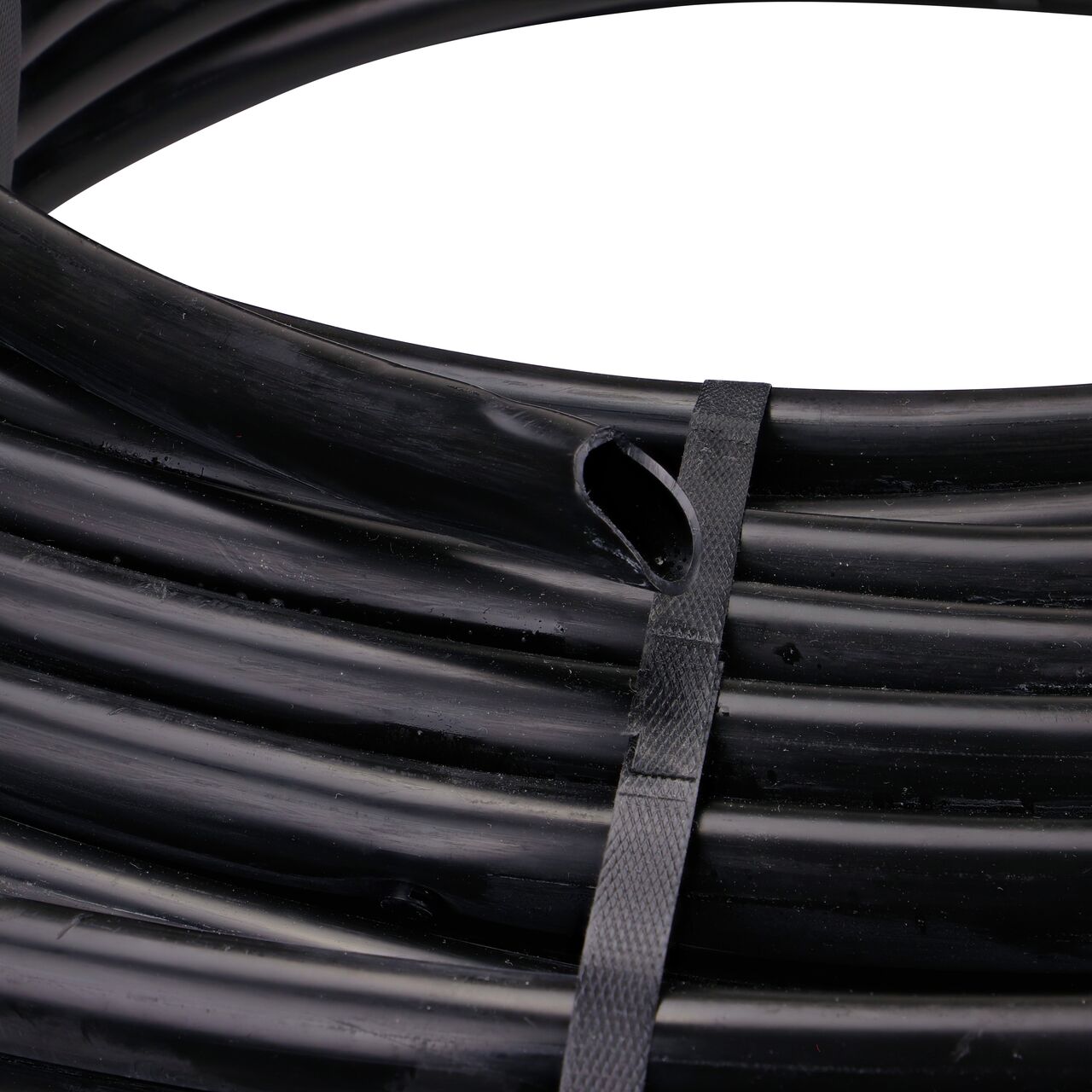 Inside end of the 500 foot black 3/4 in. Dura Flo™ Heavy-duty Dripline has 1.0 GPH Pressure Compensating Emitters in Groups of 3 spaced 6 in. apart