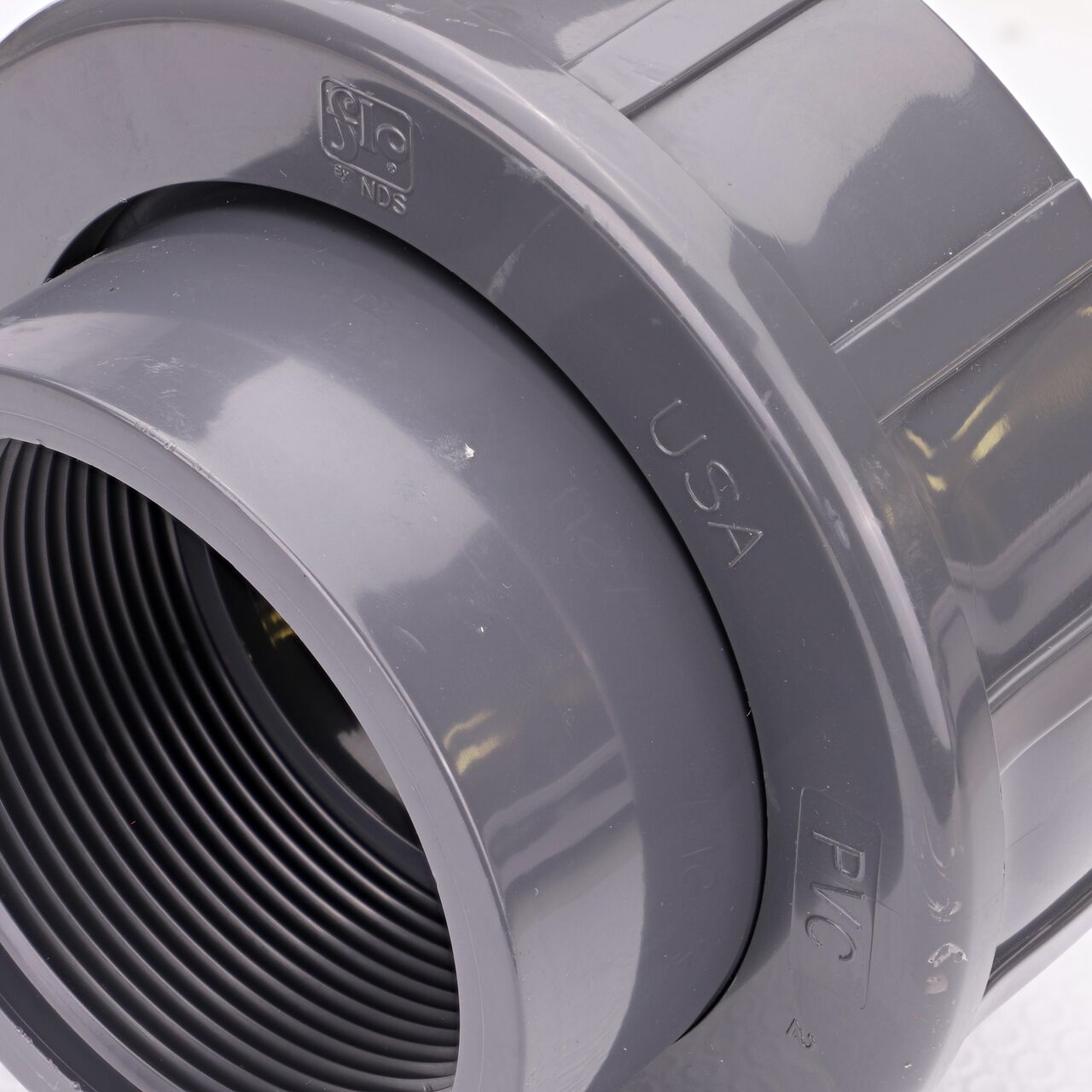 Close up view of the NDS 3 in. PVC FPT Union showing NDS brand a leader in flow management solutions and the preferred choice of professionals since 1972 mark (NDS U-3000-T)