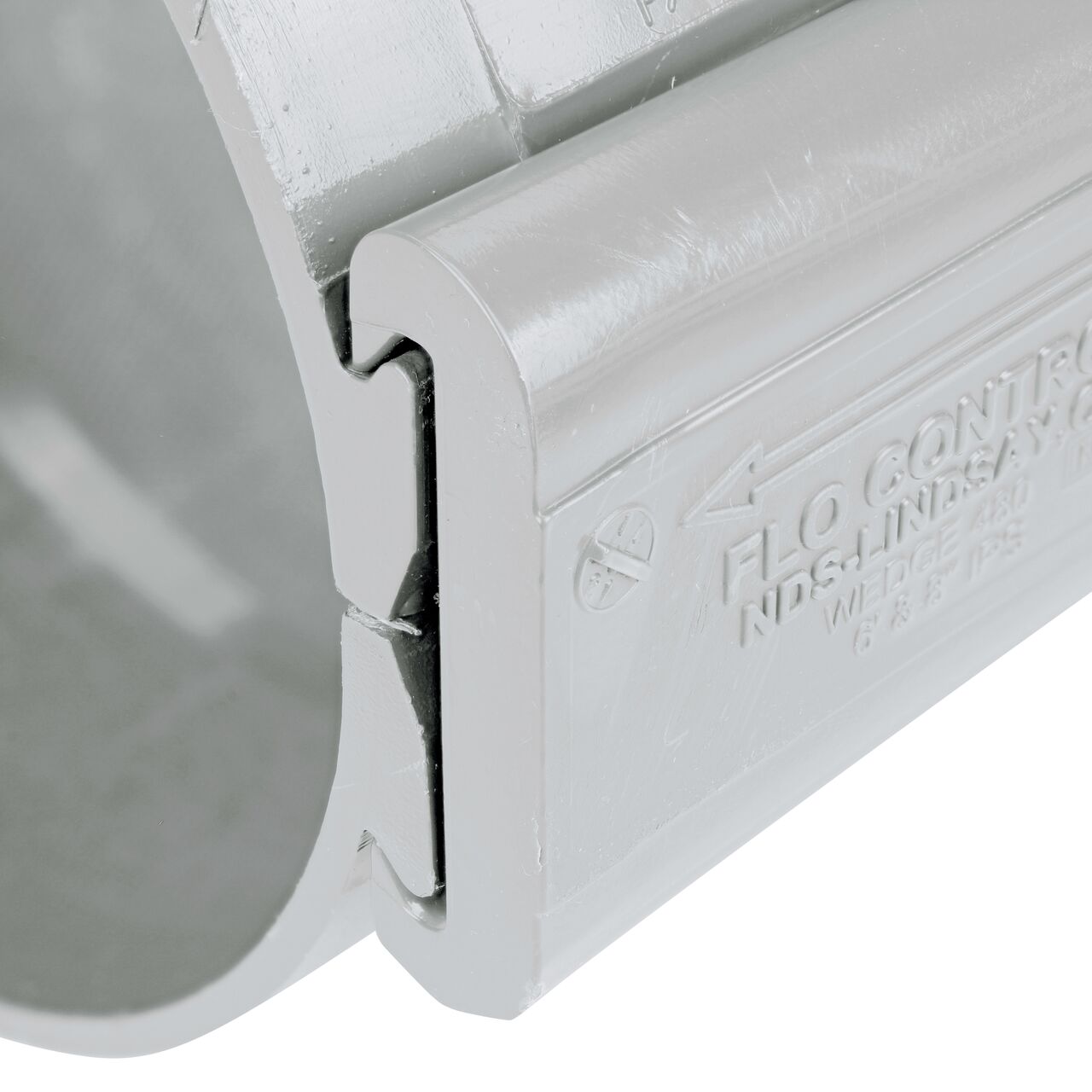 Closeup view of the wedge securely in the closed position on the 6 in. NDS Flo-Tap™ Rigid PVC saddle with 1-1/2 in. socket or 2 in. spigot (NDS 3260)
