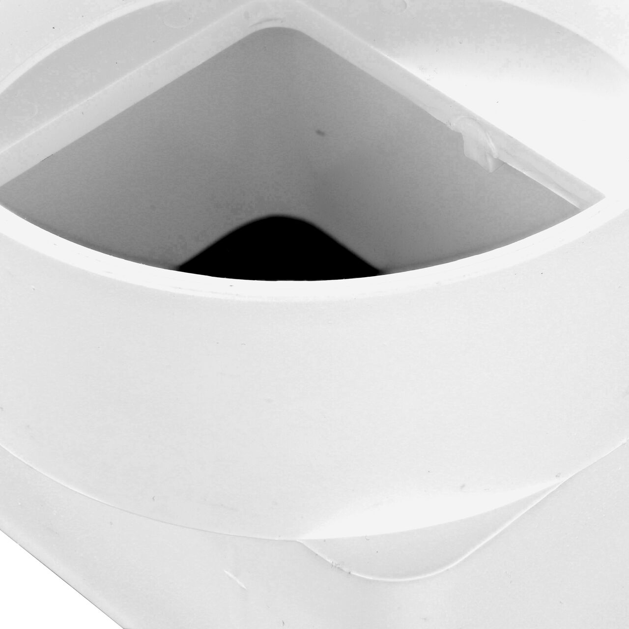 Closeup of the 3X4 in. downspout connection on the PVC offset downspout adapter (NDS 9P09)