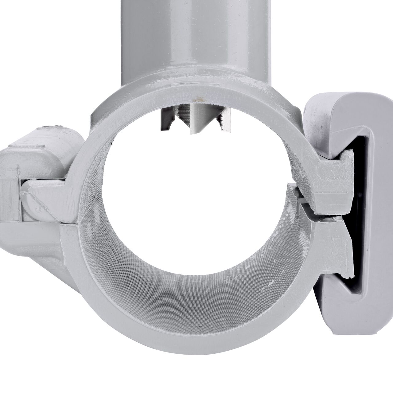 Closeup view of the built-in saw tooth cutter in position as if cutting pipe on the 2 in. NDS Flo-Tap™ Rigid PVC saddle (NDS 3120) which cuts easily through PVC pipe wall and captures debris before it can enter the water supply