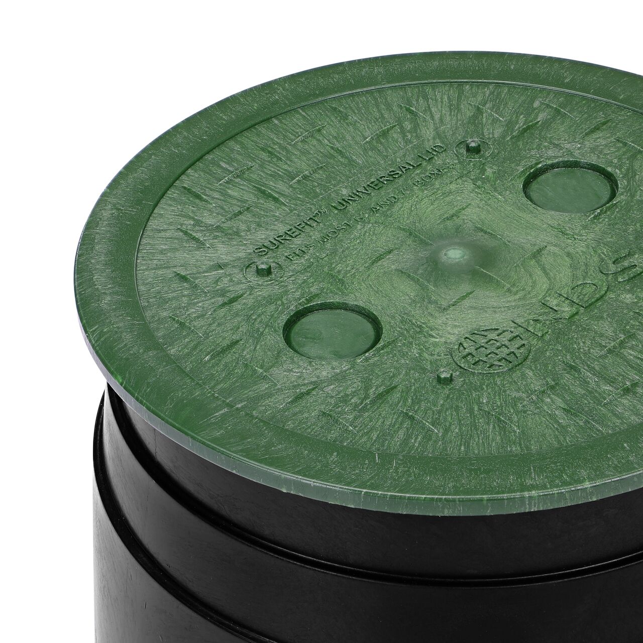 Closeup of the 6 in. Round SureFit Universal Valve Box Lid (NDS 6RND-UC) installed on a 7 in. Rainbird valve box
