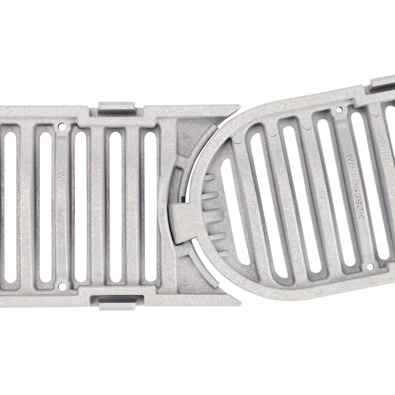 Closeup view of the underside of the grate showing the pivot joint curved to the right position 9 degrees on the NDS Spee-D® Contour™ Channel Drain Start & End Kit (NDS 400-ACSE-WH)
