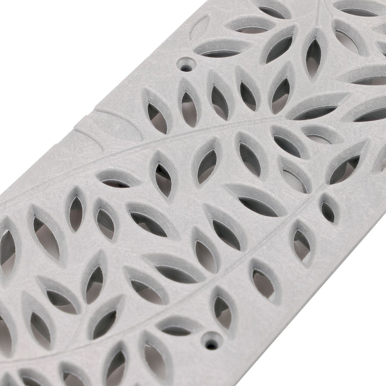 Angled view of Spee-D® Channel Drain Grate, Decorative Botanical Design in Gray Plastic (NDS 252GY)