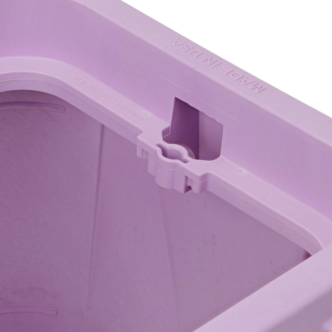 Closeup view of the bolt hole on the Purple NDS 14 in. x 19 in. Rectangular Pro-Spec® Series Valve Box (NDS 314PBCR) for securing valve lid or cover to the valve box