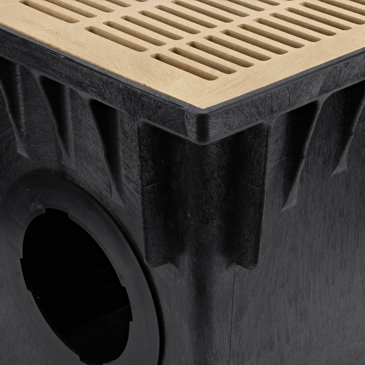 Closeup View of the sand, 18 in. NDS Square Catch Basin Drain Grate (NDS 1812S) installed on a NDS 18 in. Square Catch Basin Drain (NDS 1882)