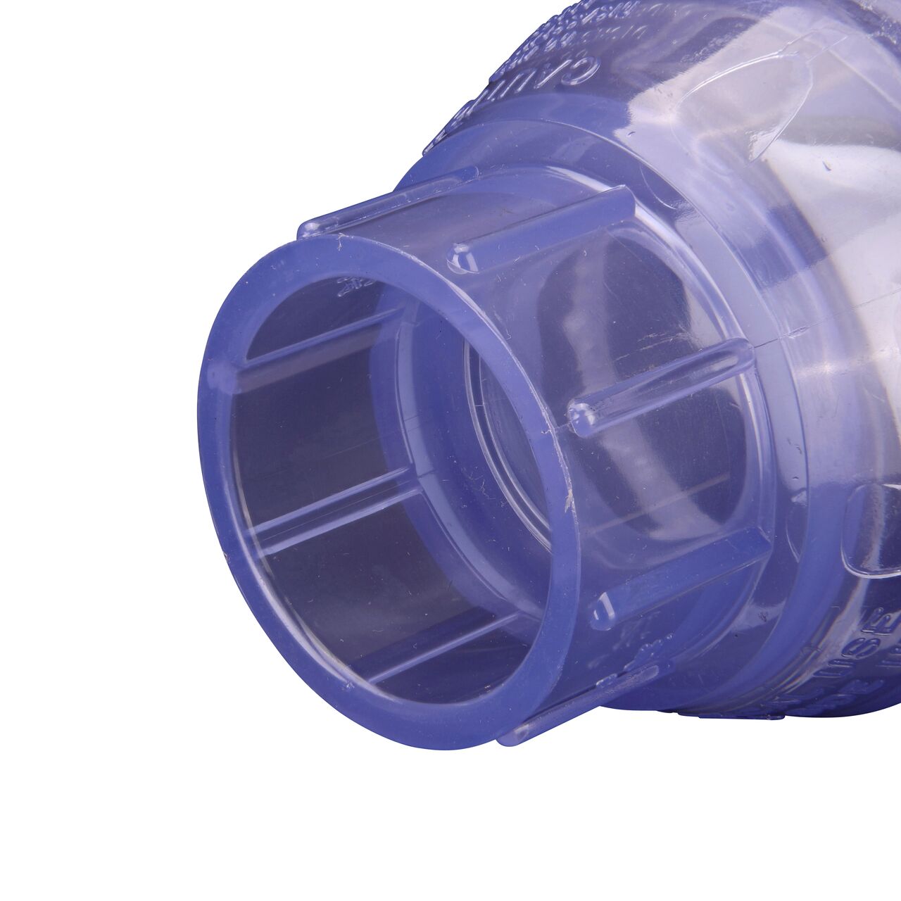 Closeup of the outlet end of the NDS Clear 1-1/4 in. slip end by slip end PVC Swing Check Valve (NDS 1520C12) which prevents backflow in pipelines