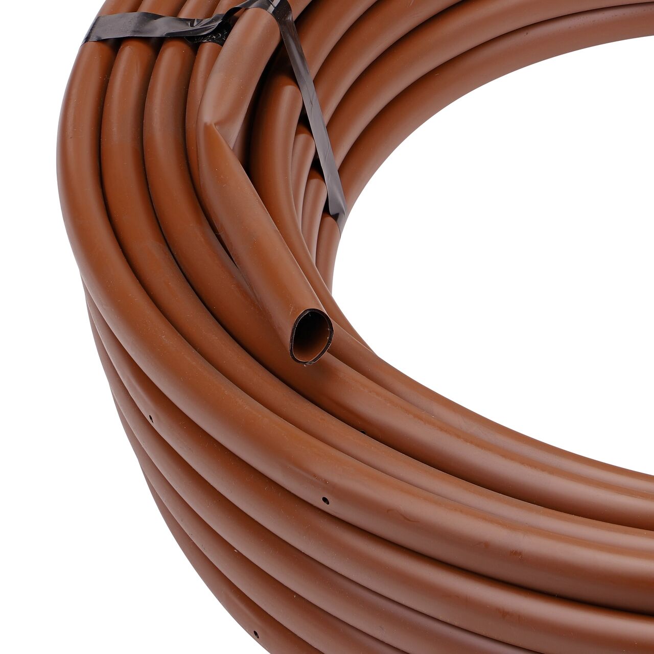 Closeup view of the inside end of the 100 foot brown NDS 16mm Dura Flo™ Dripline with 1.0 GPH Pressure Compensating Emitters spaced 12 in. apart