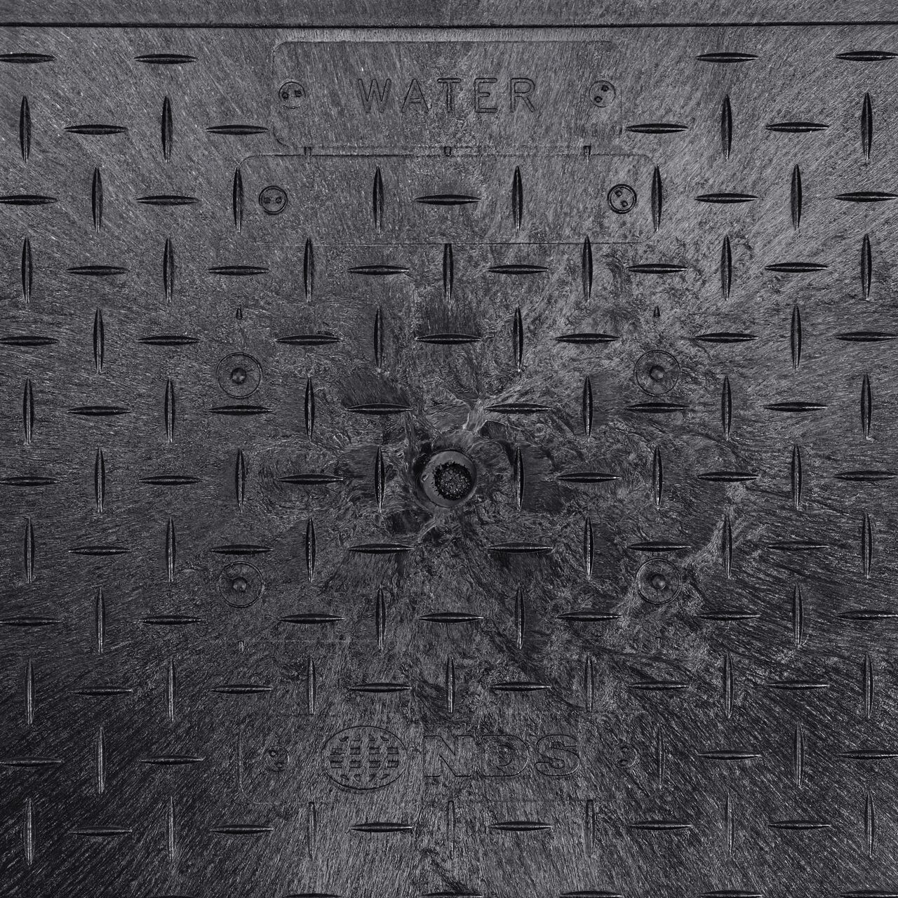 Closeup view of the Water Meter markings on the Black Water Meter cover for the NDS 13 in. X 24 in. Rectangular Pro Series Meter Box (NDS 121BCDWB)
