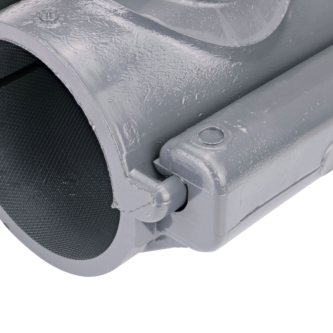Closeup of the hinge closed on the NDS Clamp-It™ Rigid PVC Saddle with 1 in. FPT connection on top (NDS 422010) for 2 in. PVC pipe