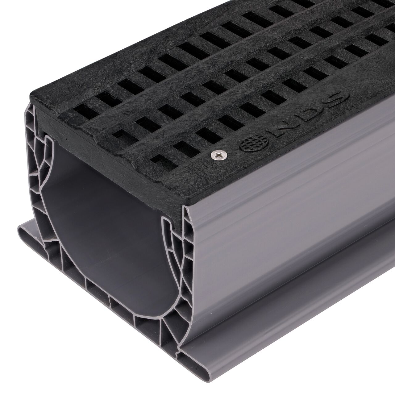 Closeup of NDS Spee-D® Channel Drain Grate, Decorative Wave Design in Black Plastic (NDS 253) installed on a Spee-D Channel Drain (NDS 400)