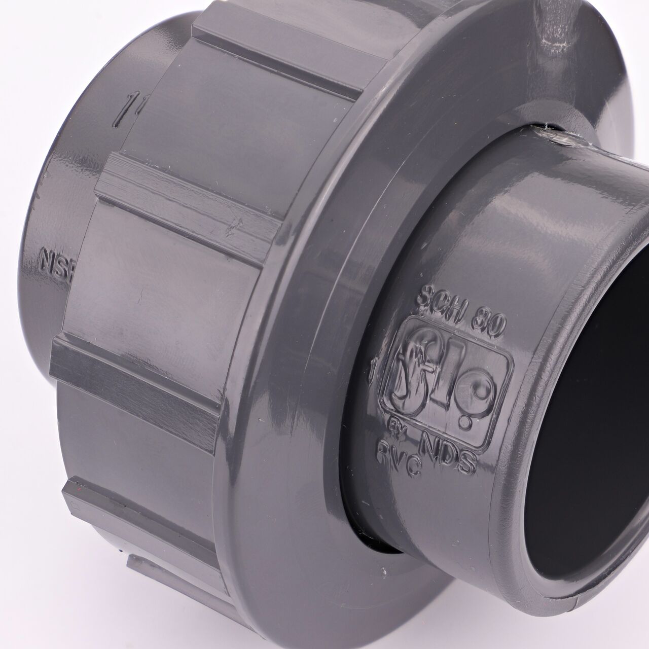 Close up view of the PVC Union, 1-1/2 in. Sch. 80 S X FPT showing NDS brand a leader in flow management solutions and the preferred choice of professionals since 1972 mark (NDS U-1000-ST)