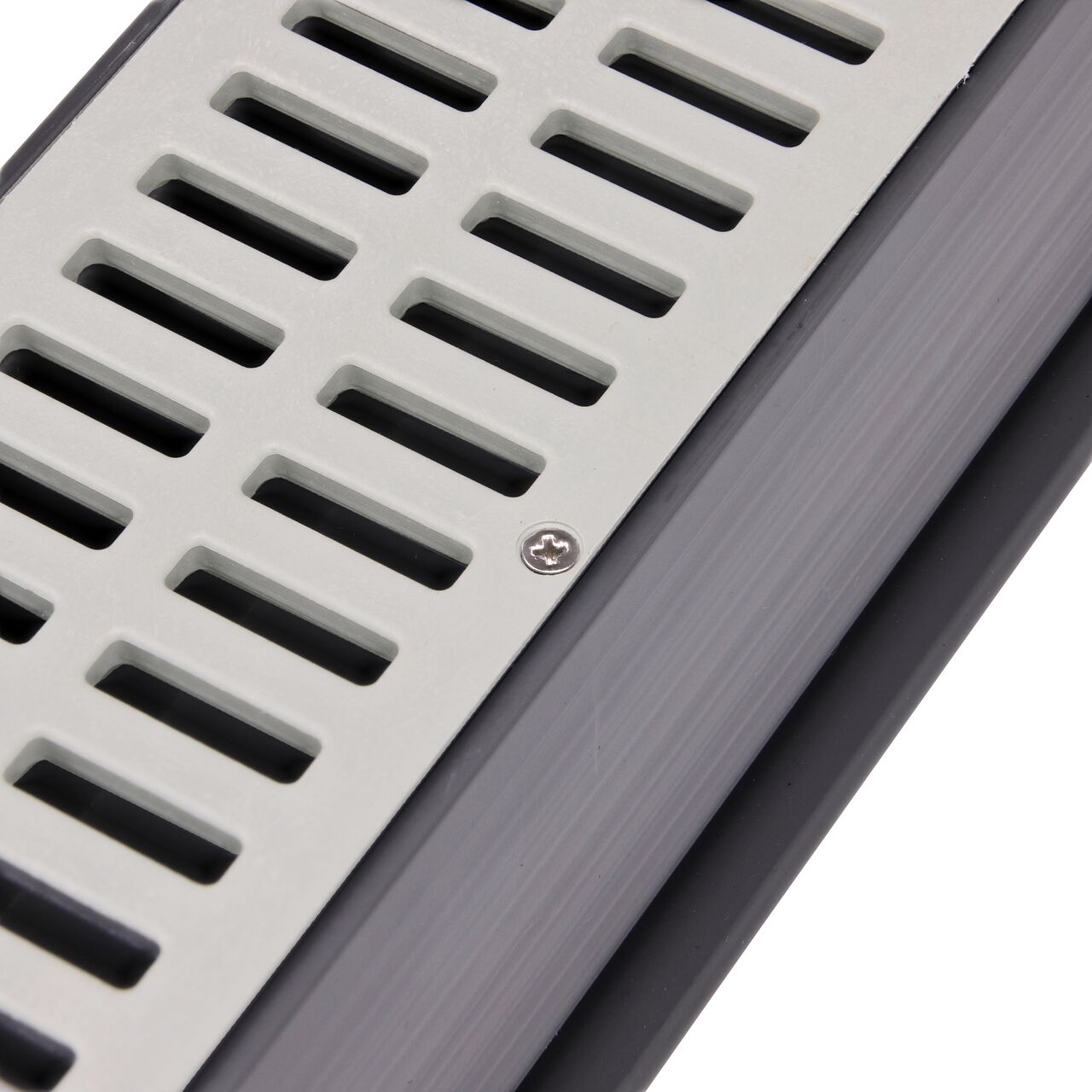 Closeup of #4 X 5/8 in. Phillips Flat Head Screw securing standard grate to Mini Channel (NDS 529)