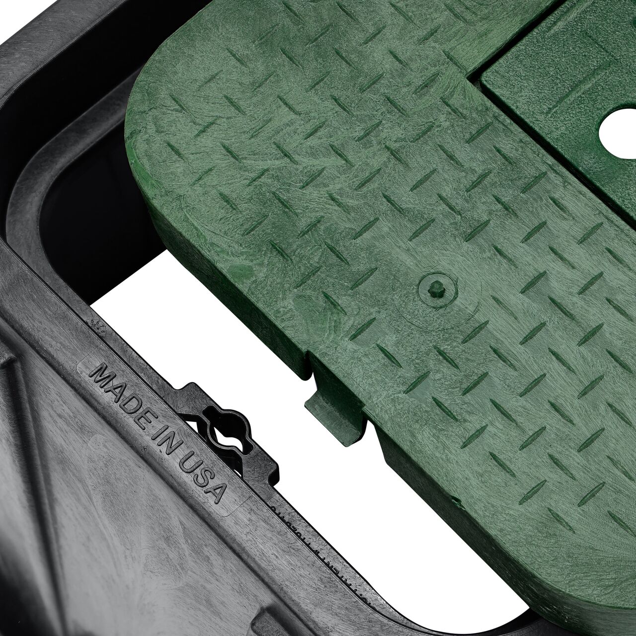 Align the bolt hole on the lid with the universal locking mechanism hole from the NDS 14 in. X 19 in. Rectangular Standard Series Black Meter Box and Green Water Meter Cover (NDS D1200-DIRG) for a secure fit