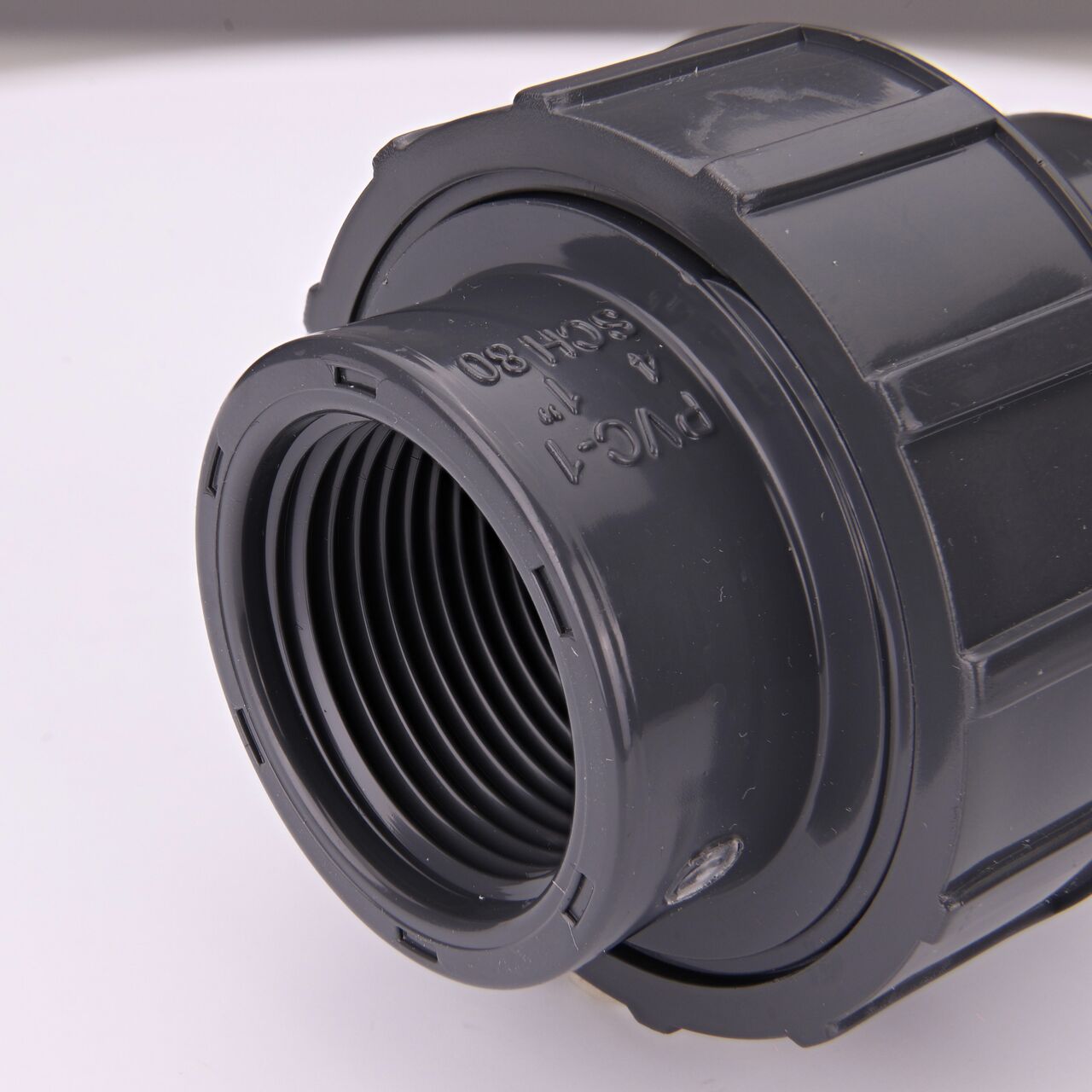 Closeup view of one threaded end on the PVC Union, 1 in. Sch. 80 S X FPT (NDS U-1000-ST)