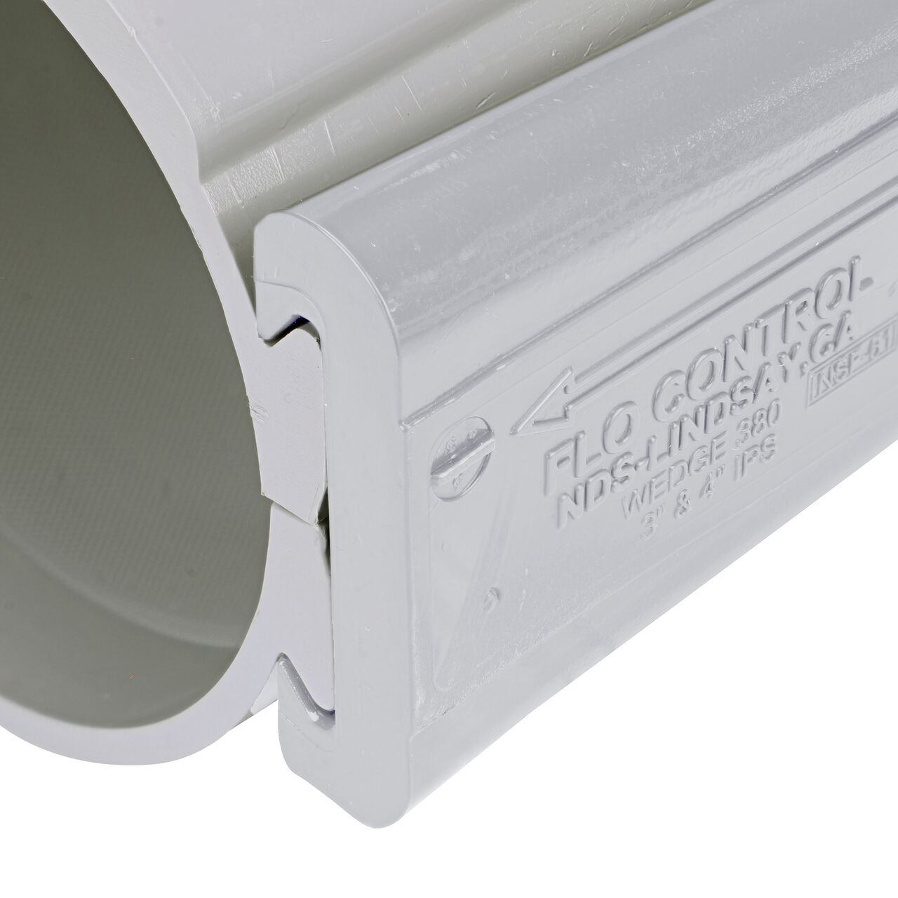 Closeup view of the wedge securely in the closed position on the 4 in. NDS Flo-Tap™ Rigid PVC saddle with 3/4 in. socket or 1 in. spigot (NDS 3140)