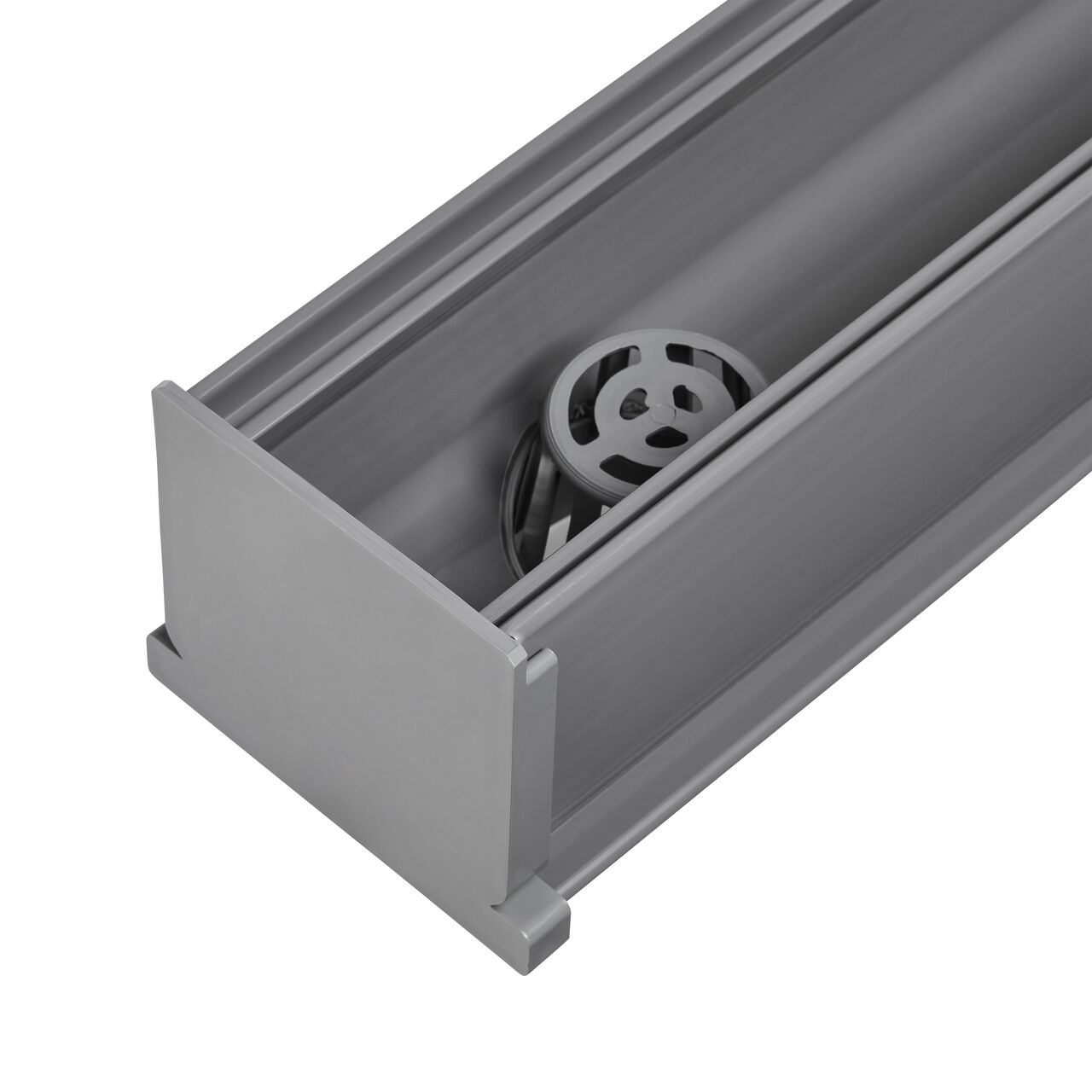 NDS Mini Channel™ Drain Bottom Outlet (NDS 550) with NDS Mini Channel end cap (NDS 547) installed to stop the flow of water and have it go down the bottom outlet through the pipes